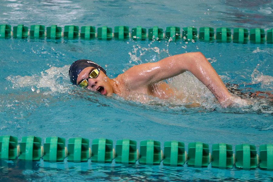 Moving his head to the side, sophomore Cole McClure takes a breath of air during the freestyle. 