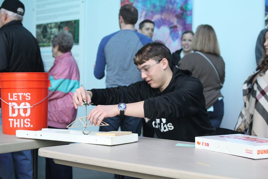 As he sets up his bridge, senior Johannes Seaburger puts a hook into his structure.