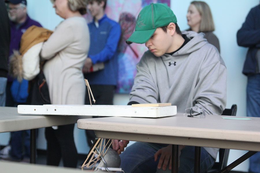 As his bridge falls from the weight of the sand, senior Drew Lewis watches.