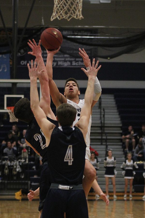 At the beginning of the game, senior Matty Wittenauer attempts to score.