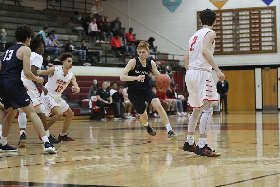 Penetrating the lane, junior Braeden Wiltse attempts to score.