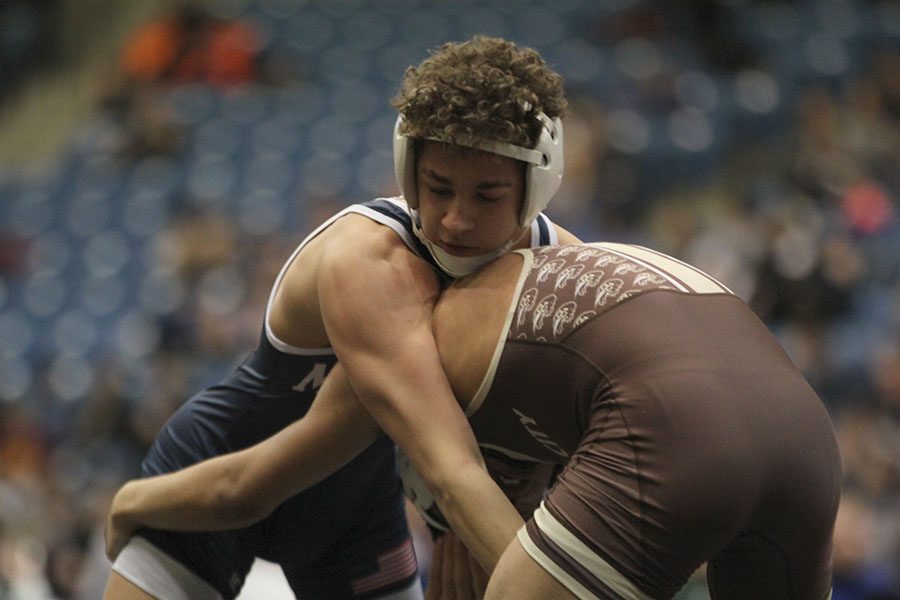 Grabbing his opponent, junior Zach Keal strategizes his next attack.