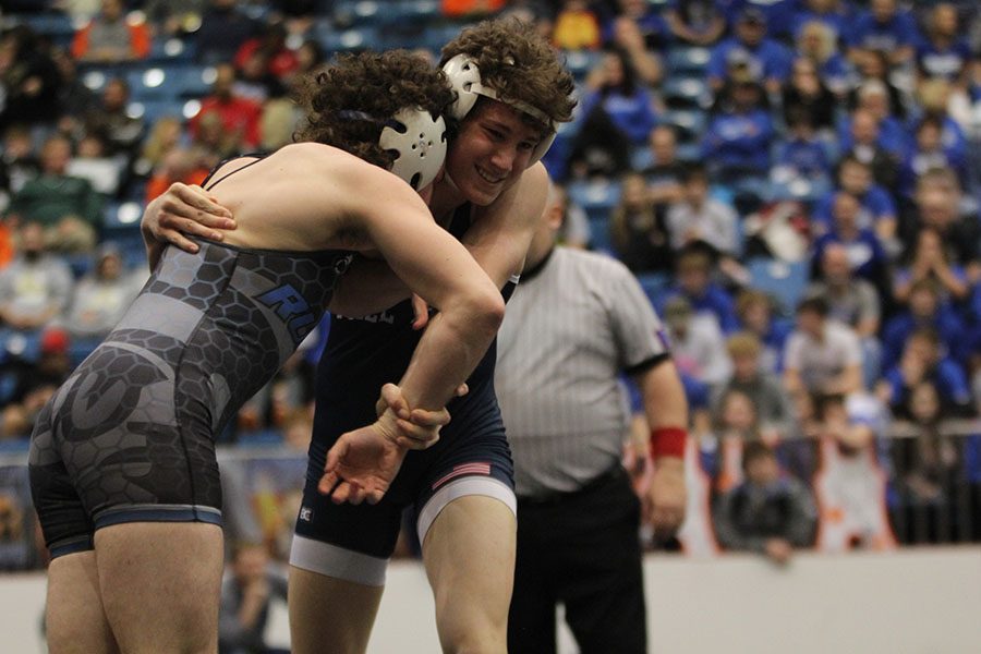 As his opponent pushes into him, sophomore Brodie Scott looks to his coaches for direction.