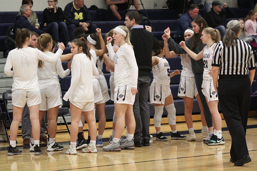 Following a 30 second timeout, the girls break down their huddle.