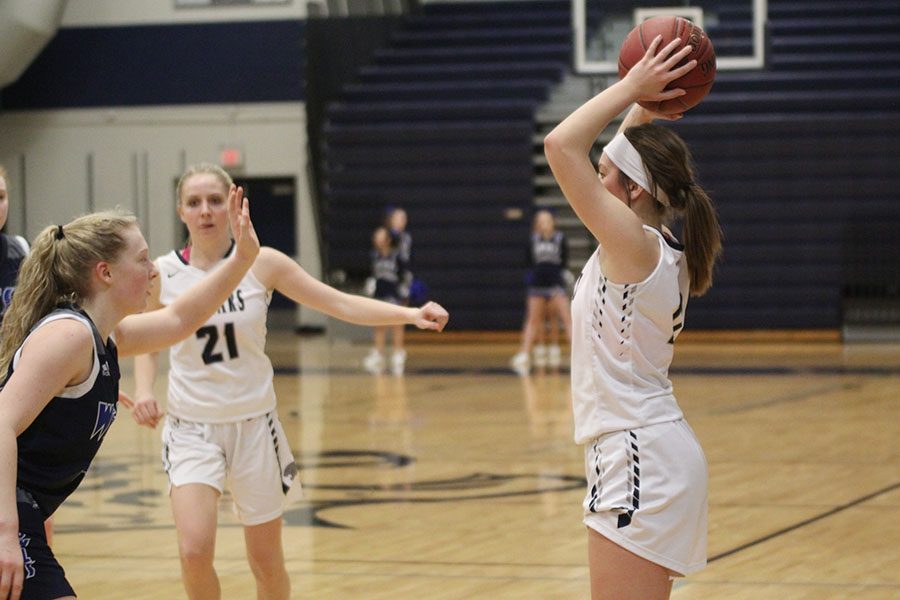 After a foul on Olathe West, junior Ella Shurley scans the court for a player to throw the ball in bounds to.