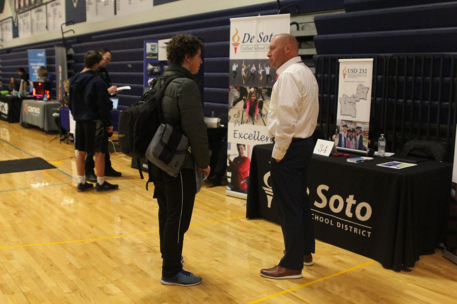 Junior Gilbert Vandegrift talks about education with Brian Schwanz from the Desoto school district.