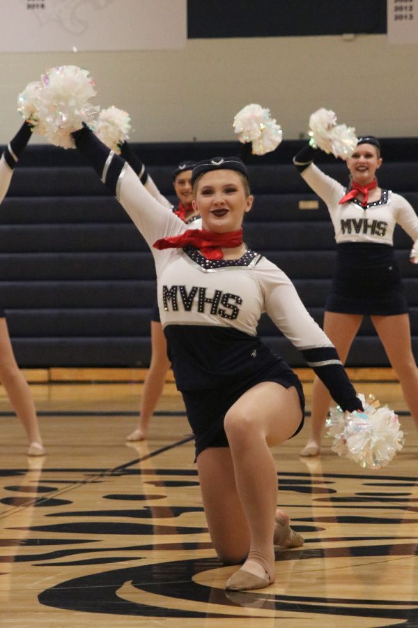 At the spring show on Saturday, March 30, sophomore Jenna Haase performs in the pom routine.