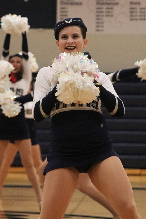 Dancing in the spring show on Saturday, March 30, senior Olivia Augustine performs in the pom routine.