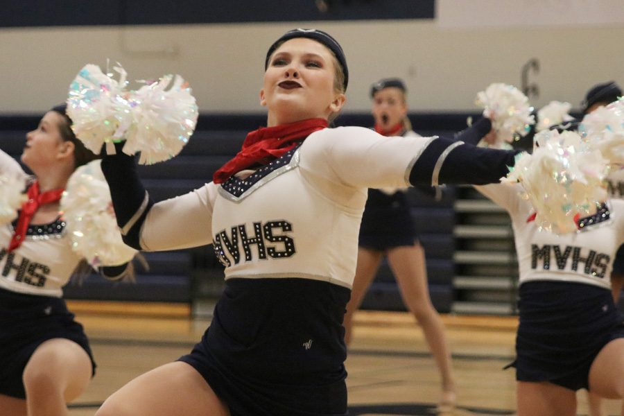 At the spring show on Saturday, March 30, sophomore Jenna Haase performs in the pom routine.