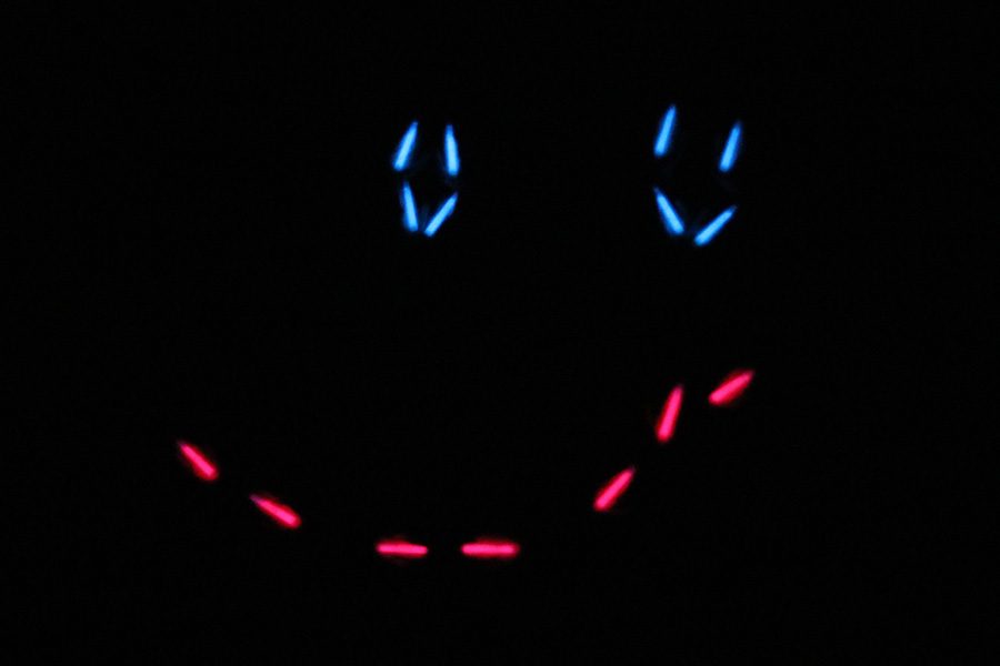 Silver Stars gather to form a smiley face out of light sticks during the light show on Saturday, March 30.
