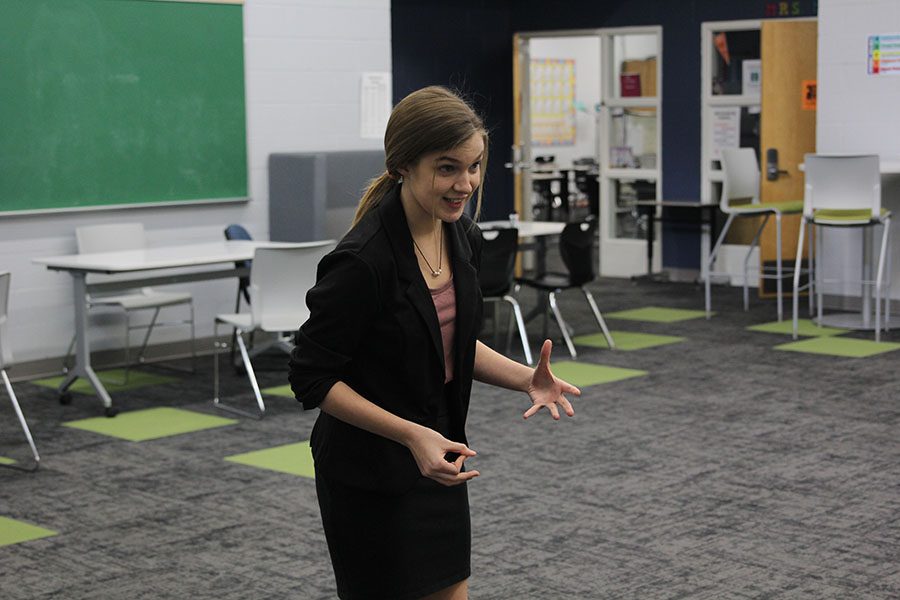 Before finals, sophomore Patty McClain practices her info and impromptu.