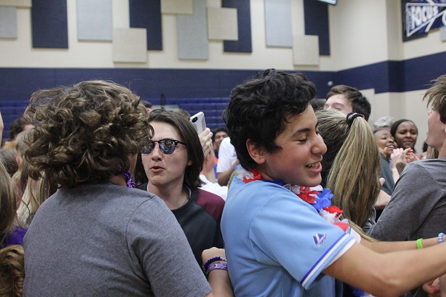 The dance party continues after being moved from the main hallway to the gym.