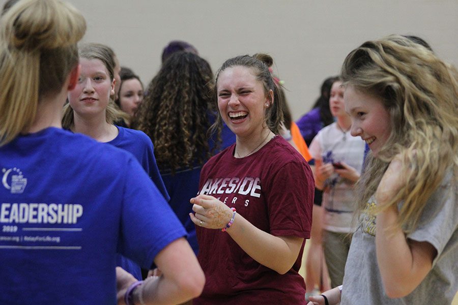 Junior Kylie Conner laughs with her friends at the dance party.
