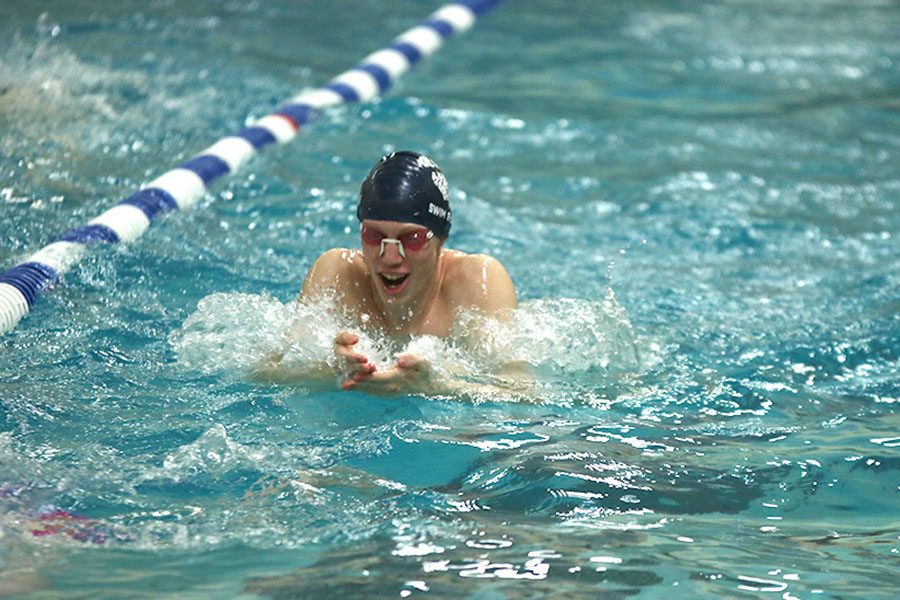 Swimming breaststroke, senior Chris Sprenger practices at Pioneer Trail Middle School on Tuesday, Feb. 26. Being able to keep up for an entire two and a half or three hour workout is incredibly difficult, Sprenger said.