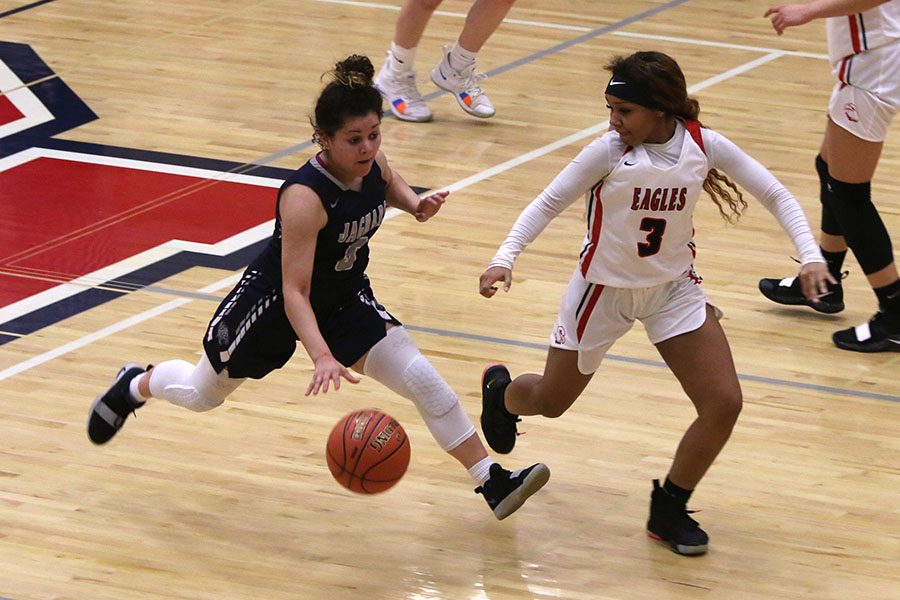 While in overtime, senior Presley Barton runs toward the goal. In the second round of substate against Olathe North on Saturday, March 2 the Jags lost in overtime with a score of 74-56.