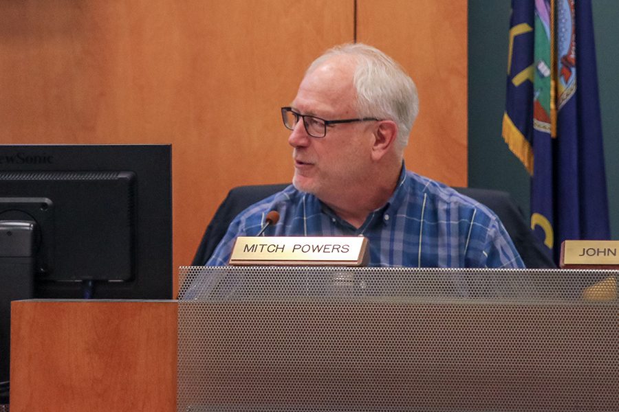 At the Board of Education meeting on Monday, March 4, board member Mitch Powers voices his concerns to the board and audience members. “I get concerned about the risk that [will be] taken on by [USD 232] if we were to pass it,” Powers said. 