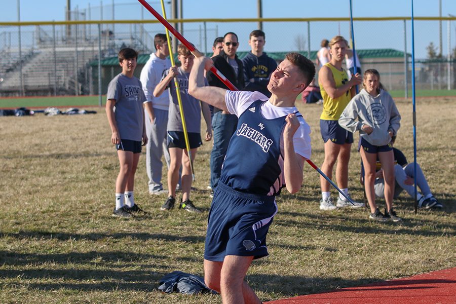 Running down the runway, sophomore Alex Brewer lets go of the javelin.  