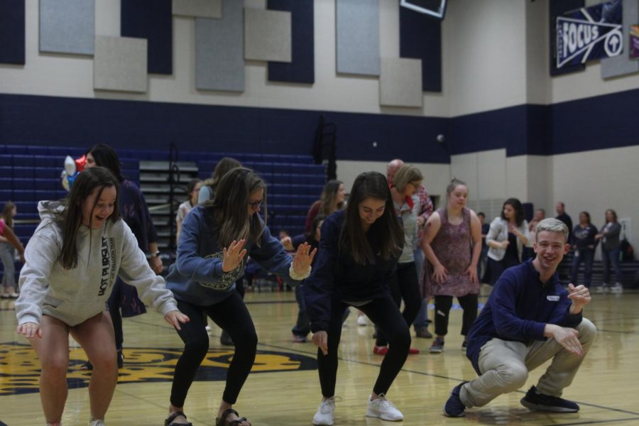 Dancing to “Cha Cha Slide” by DJ Casper, junior Kaitlyn Gowin, sophomore Rylee Fouts, sophomore Taylor Bruce and senior Ethan Males enjoy one of the many activities at the Special Populations Prom