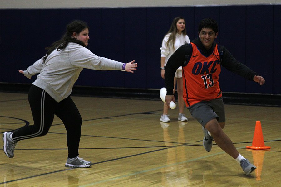 Stealing a pin from the senior team, sophomore Prathik Gadiraju dodges defender freshman Elisabeth Peters.