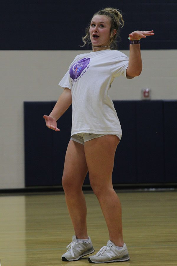 Dancing to the music, freshman Cooper Goetsch strikes a pose.