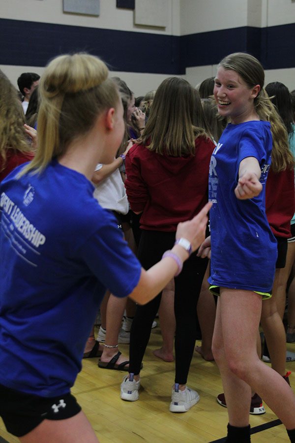 As an ABBA song plays, junior Megan Proctor dances among the crowd.