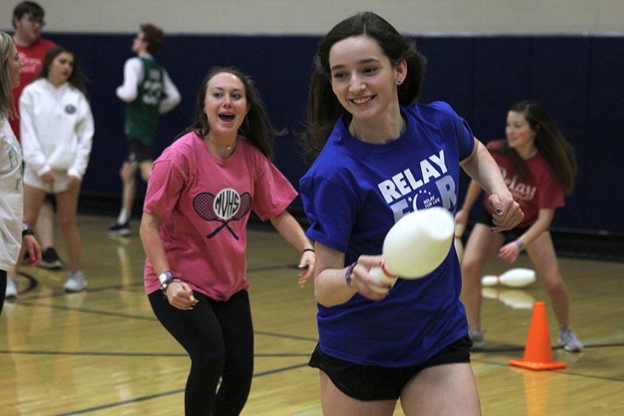 Running away from senior Sydney Fisher, sophomore Lauren Acree escapes with a bowling pin.