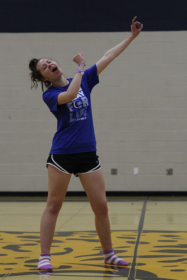 Holding up an imaginary microphone, freshman Alyssa Canning rocks out to I Wont Say Im in Love from Hercules.