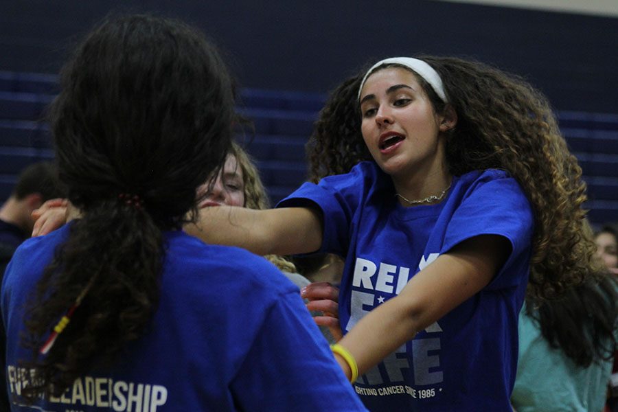 After moving into the auxiliary gym, sophomore Nichole Crist dances to Dancing Queen by ABBA.