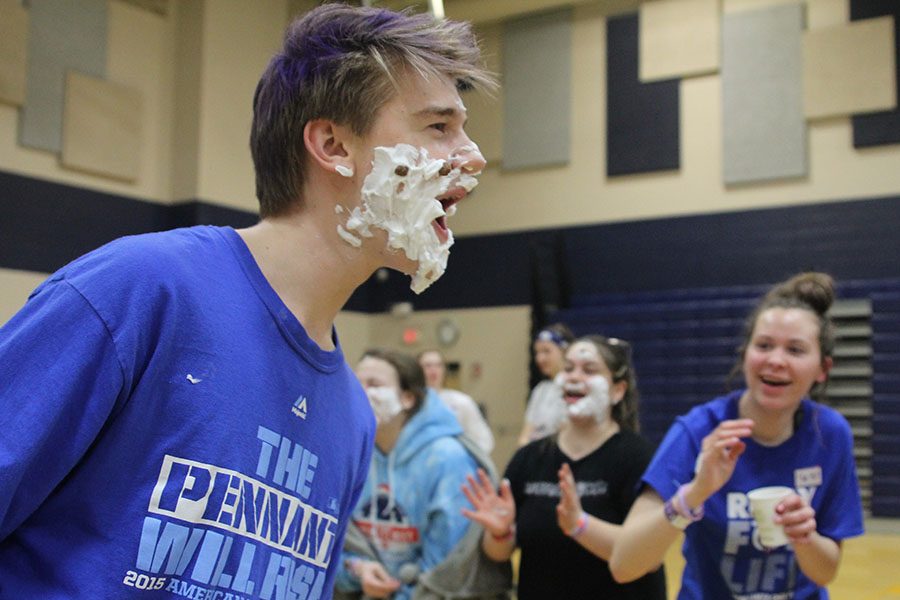 During the chocolate beard event, freshman Bret Weber shows off his shaving cream beard to peers.