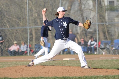 Going through his motions, sophomore pitcher Lucas Mahoney throws the first pitch of the bottom of the fifth inning, en route to a 5-2 victory. Everyone started getting hyped in the dugout, and it carried over onto the field, Mahoney said.