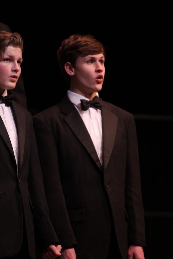 Beginning the evening, senior Noah Smith performs with the Jag Singers as they sing “Festival Gloria” by Randall Johnson.