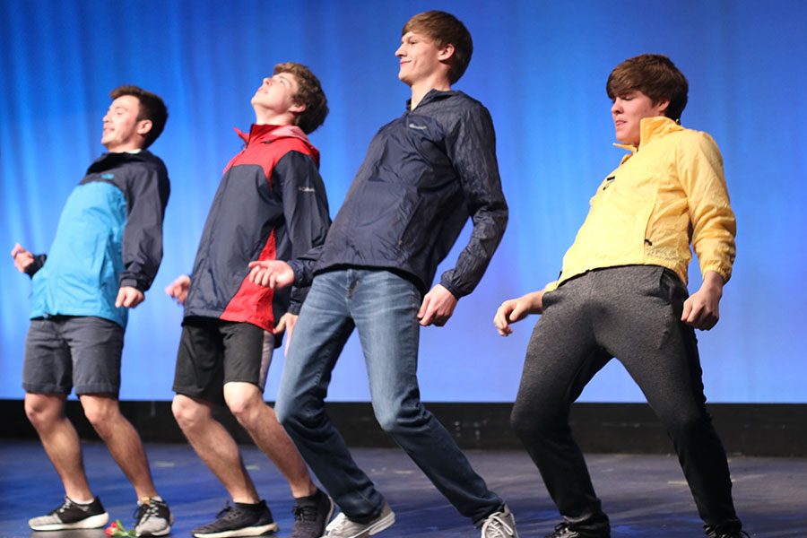 With “It’s Raining Men” by The Weather Girls playing, the Mr. Mill Valley contestants perform their choreographed dance routine.