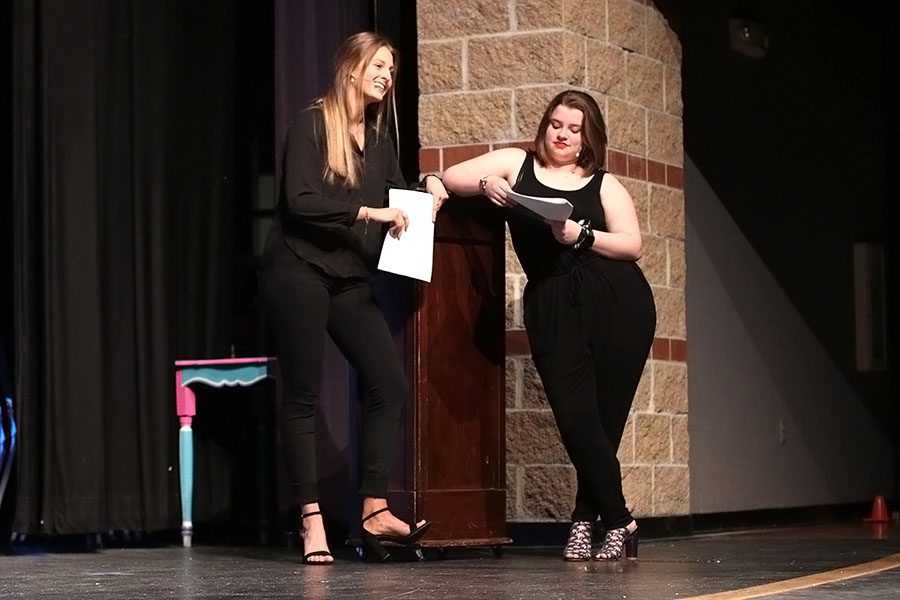 While the contestants prepare for the first competition, hosts junior Annie Bogart and senior Lindsey Edwards crack a joke.