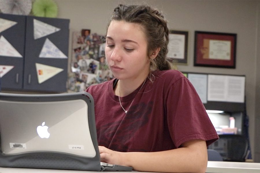 During the one-to-one pilot testing, senior Nicole Wieschhaus test’s out a MacBook Air by taking notes on the device. Next year every student will have the option to use this device in school.