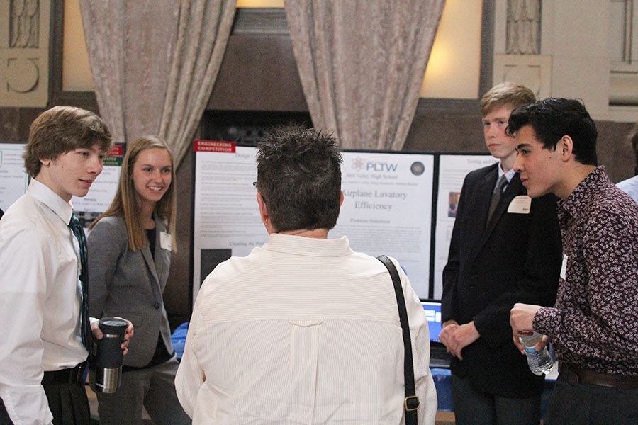 Seniors Andrew Thomas, Aniston Cumbie, Harry Ahrenholtz and Matthew Richle give a presentation over airplane lavatory efficiency; their project placed 10th in innovation awards.