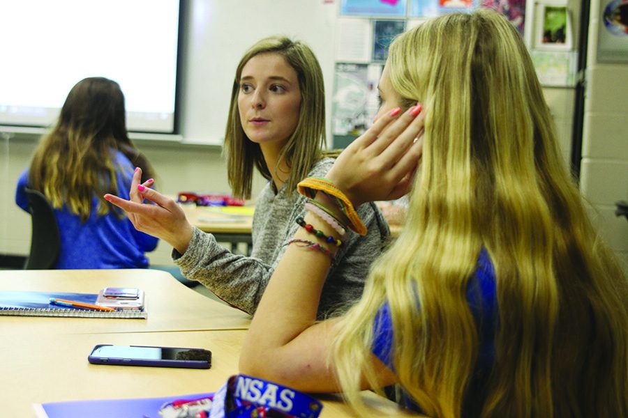 To gain more college credit while in high school, seniors Ashlyn Horton and Allie Sagi attend a JCCC public speaking course held at De Soto High School on Thursday, April 4th.   