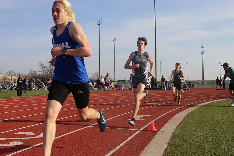 Starting his second lap, sophomore Karch Crawford competes in the 1600 meter run.