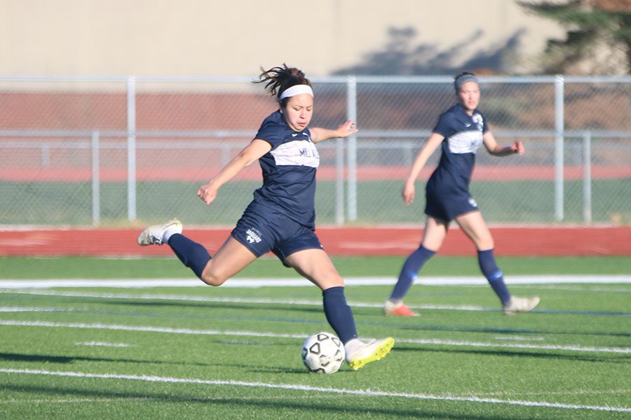 Focused on the ball, junior Tina Talavera takes a shot on goal. The jags won with a final score of 3-0. “We connected the ball really well and we got into their back line a lot,” Talavera said, after the game.
