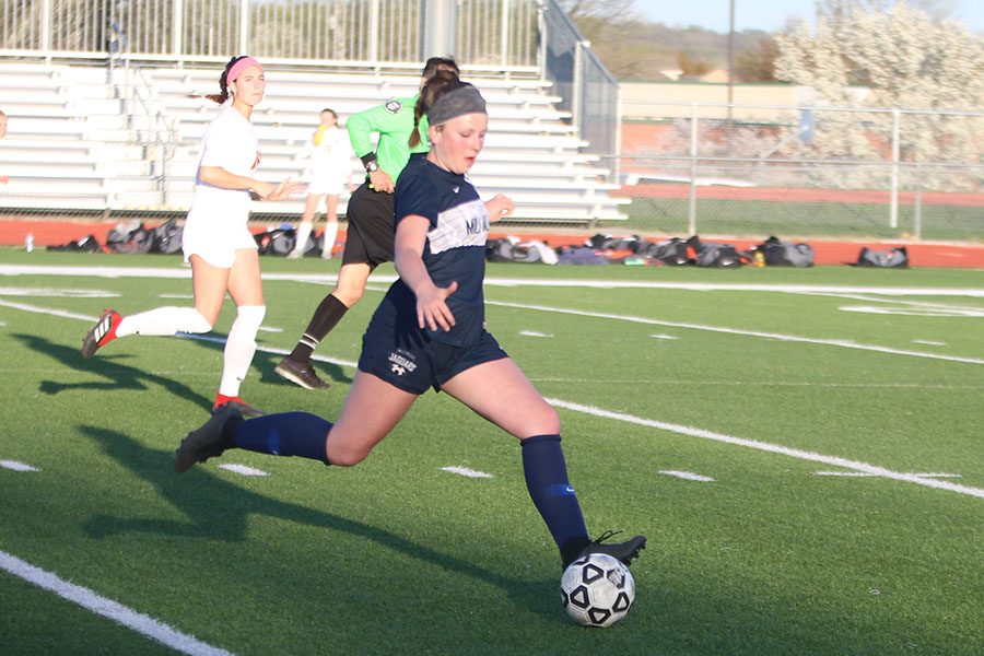 With her eyes on the ball, sophomore Paige Goetsch gets ready to pass the ball.
