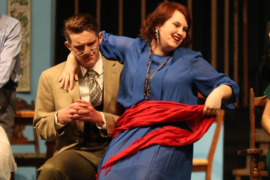 Waking up from her drunk slumber, Gay Wellington, played by sophomore Madelyn Augustine walks over to sit on Mr. Kirbys lap, played by sophomore Micheal Brown during dress rehearsal Thursday, April 10. 