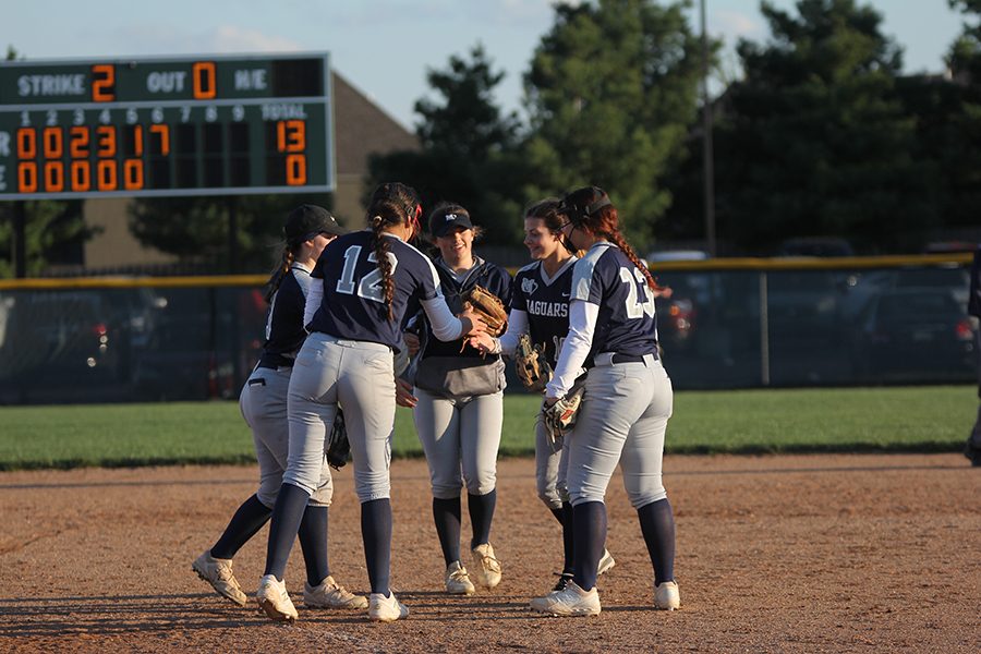 In the pitchers circle, juniors Taylir Charest, Lauren Florez, and Kylie Conner along with senior Payton Totzke and sophomore Ava Bredwell do their handshake before the inning starts. 