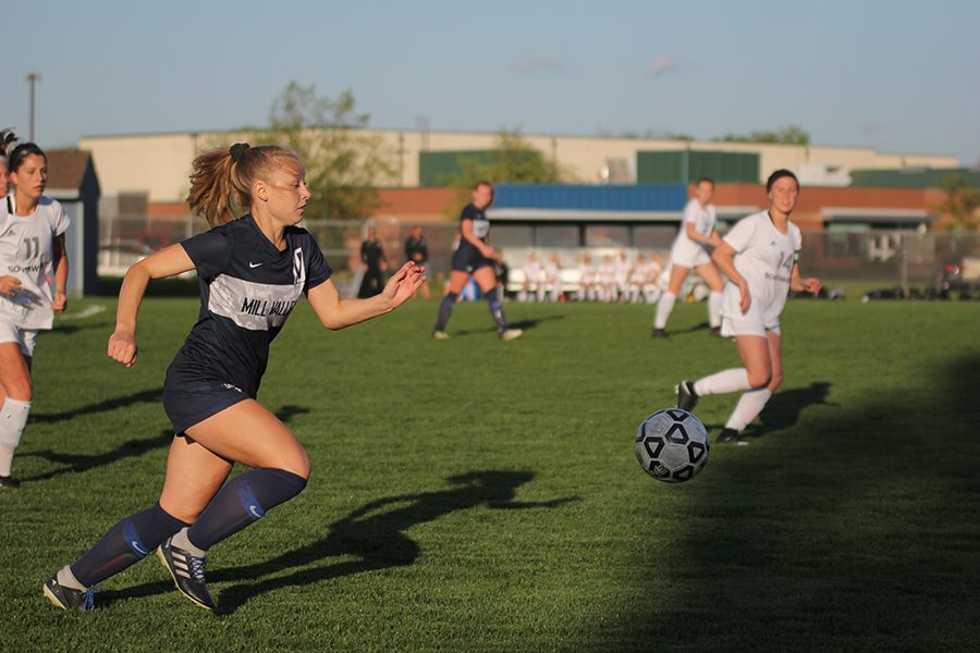 Along the sideline, right forward junior Ashlyn Dempsey chases a break-away and heads to the opposing teams goal.