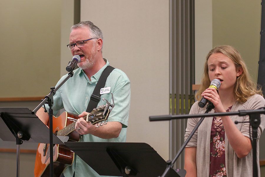 Starting off the Easter service at Common Grace church located in Olathe, Kansas, physics teacher Chad Brown and senior Sydney Clarkin perform the song Awake My Soul by Mumford and Sons Sunday, April 21. We were just talking about music one day and I showed him the song Waiting on June and I was like, ‘I really want to try this sometime, and he was like ‘Why don’t we? Clarkin said. He just brought his guitar to school one day and we started working on it. 