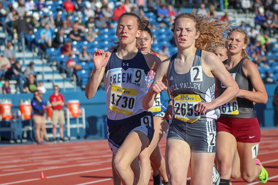 Leading a group of runners, sophomore Molly Ricker completes the first lap of the 800 meter run.  