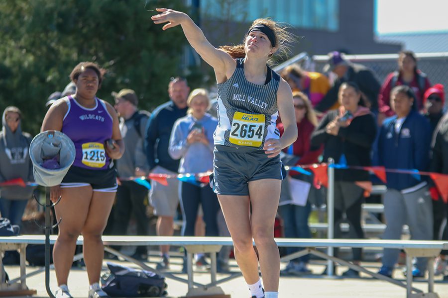 After spinning around, senior Claire Kaifes releases the shot put.  