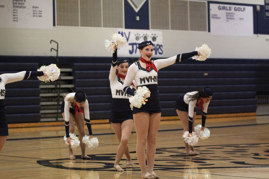 During the first dance of the night, sophomore Kenzie Harris poses in front of sophomore Lauren Acree. 