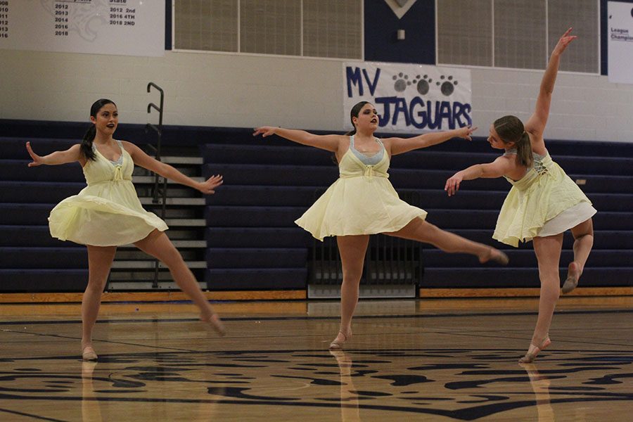 While spinning, juniors Ali Greenhalgh, Samantha Pennington and Sydney Ebner perform their all juniors routine. 