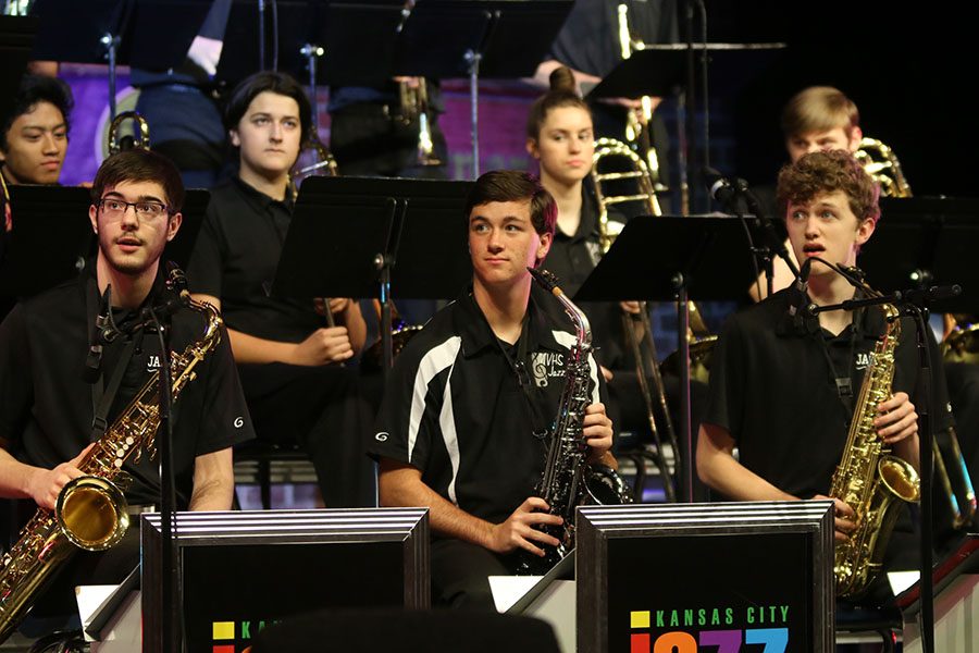 Juniors Adam Tilden, Joey Gillette and sophomore John Fraka look at band director Deb Steiner before their performance