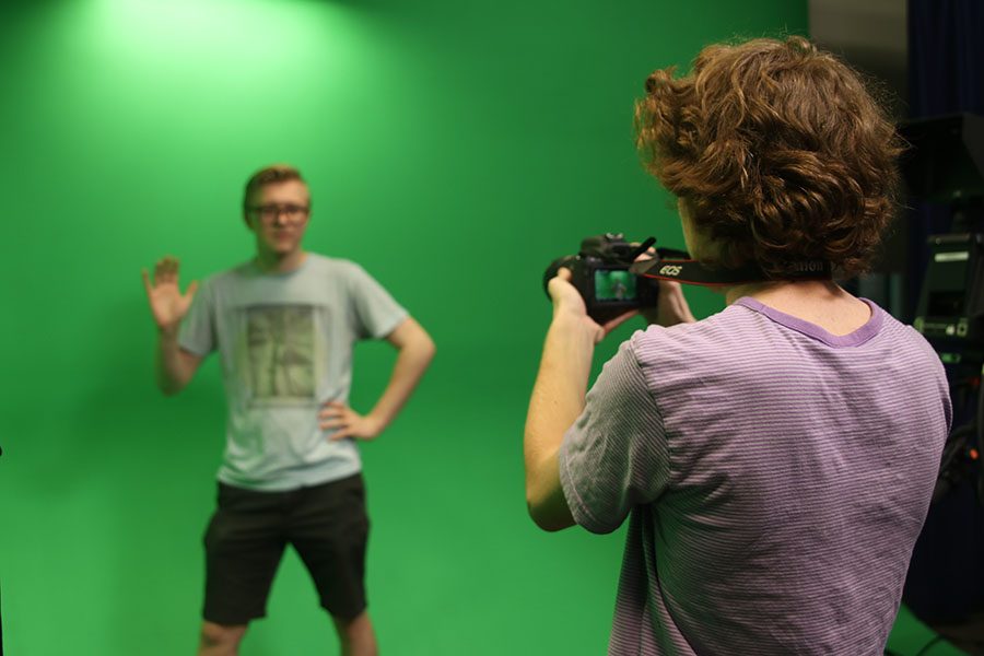 While filming, senior Jack Mahoney and junior Bennett Doyle record a funny intro and use unique ways to present an interesting news story.