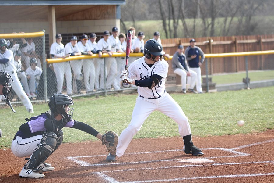 Watching the ball, senior Quinton Hall prepares to swing the bat.